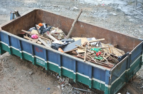 Demolition site with waste materials in Barkingside