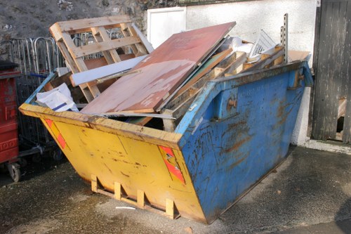 Company representative reviewing a skip hire complaint form